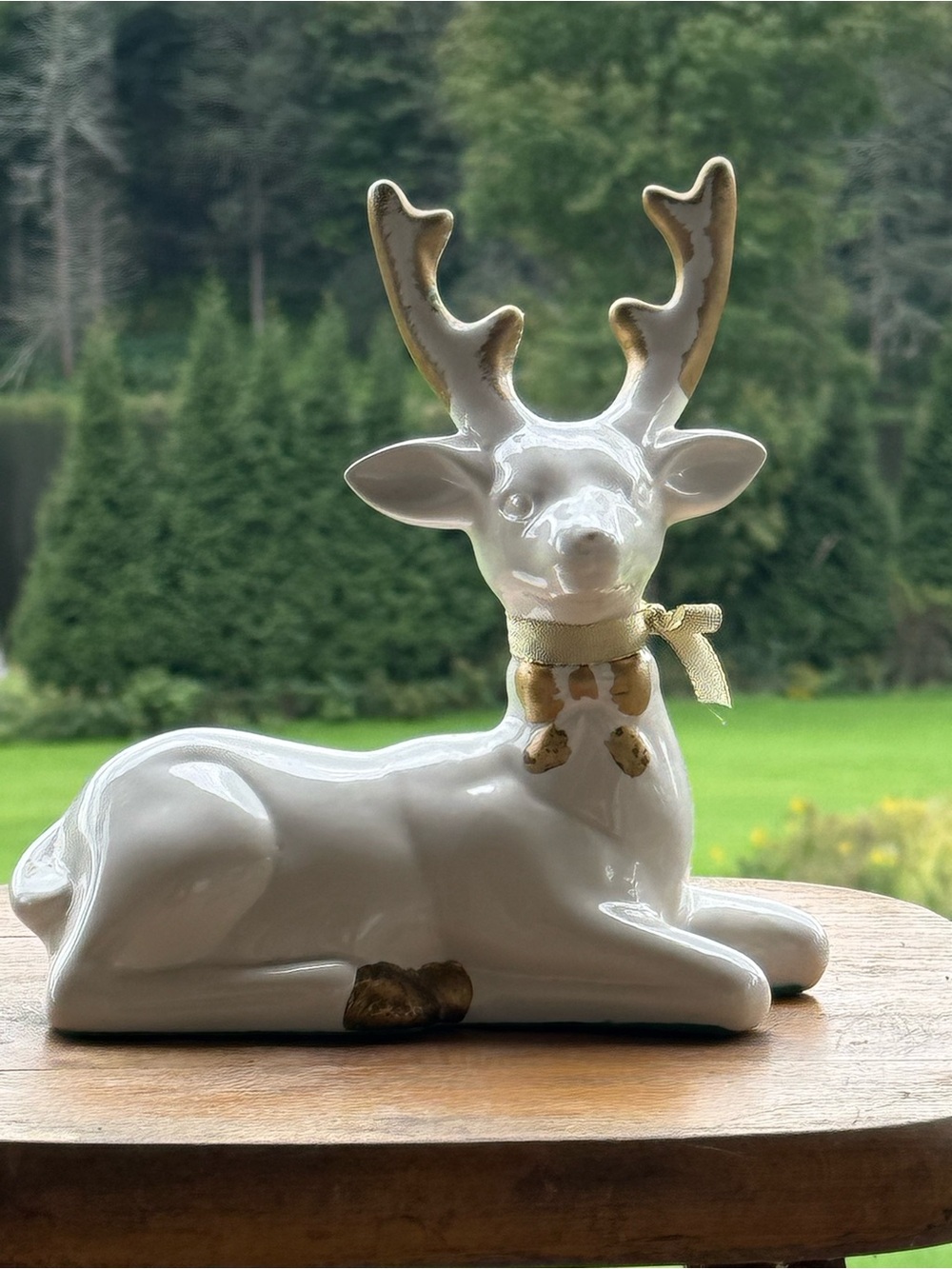 White Ceramic Reindeer Figurine with Gold Accents